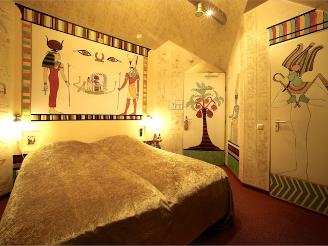 Egyptian symbols, hieroglyphics and images of gods surround you throughout the room.