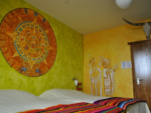 The Giant Cactus is a colourful family room with two double beds.